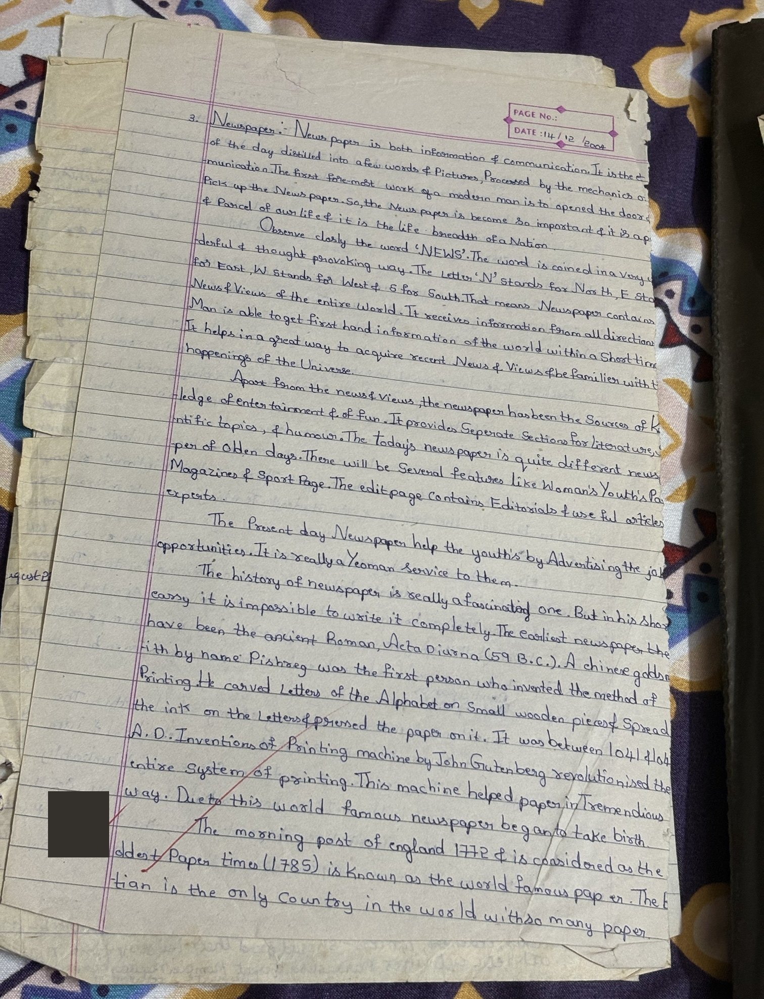 Handwritten essay on newspapers dated 14 December 2004.
